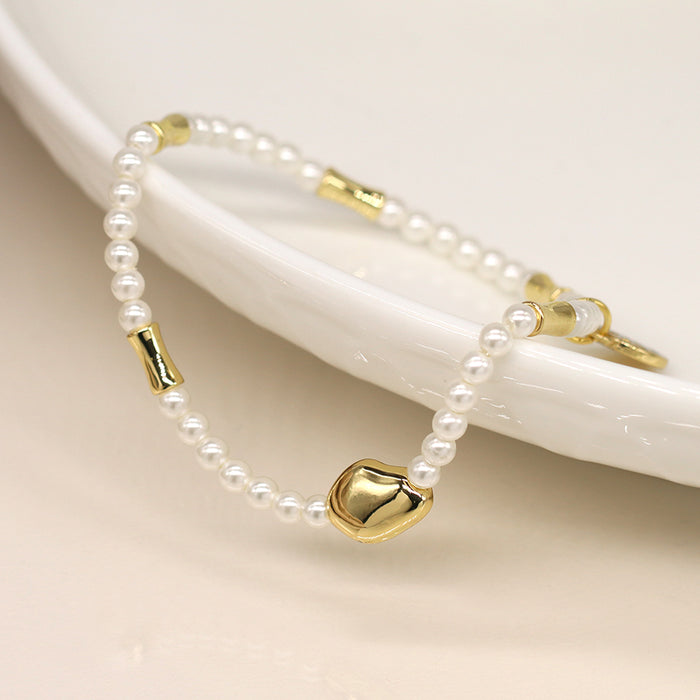 Ivory seed pearl and gold bead bracelet