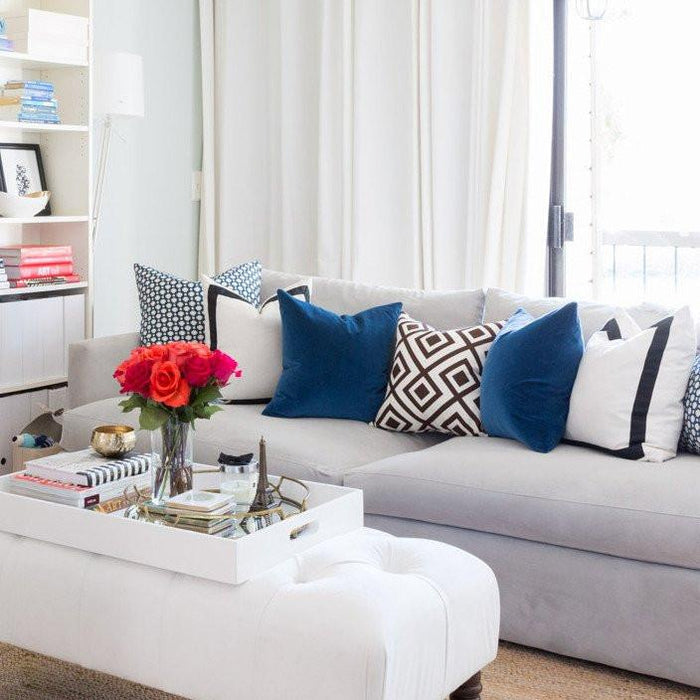 Betwixt Indigo Blue, Solid White with Black Grosgrain Ribbon Border, Marine Blue Velvet, La Fiorentina Brown Pillow Combo on sofa | Arianna Belle