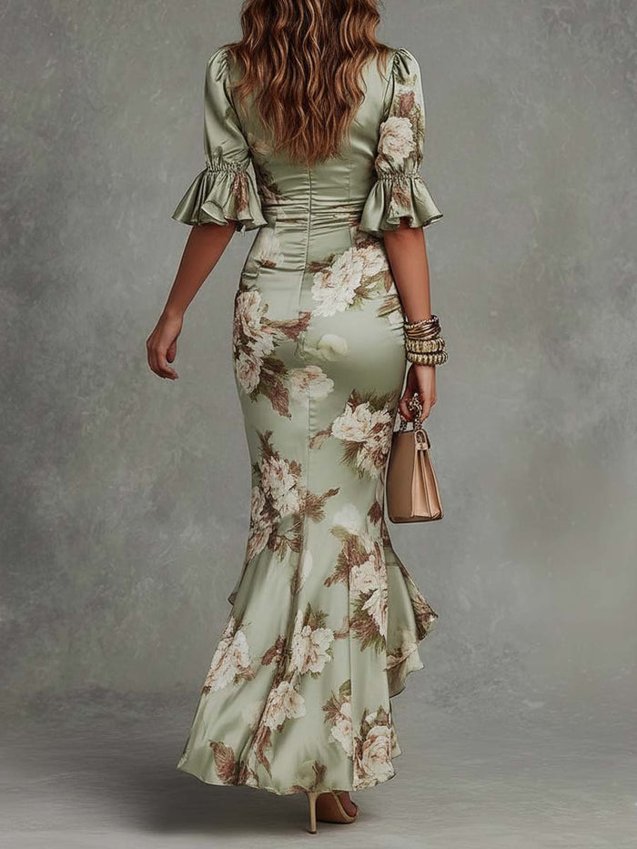 Anna - Asymmetrical long dress in green satin with V-neck, flared ruffled sleeves, and floral pattern
