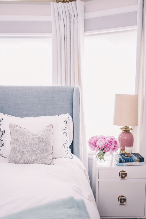 Confetti Cream & Black with Rose Pink French Piping Custom Designer Pillow from Arianna Belle on bed | home of Julia Berolzheimer
